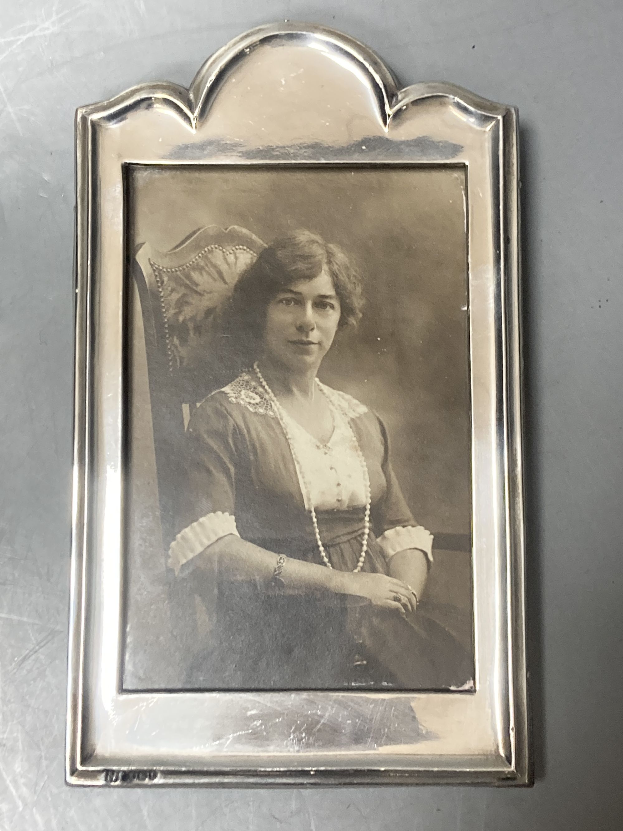 A pair of George V silver mounted photograph frames, Boots Pure Drug Company, Birmingham, 1918, 19.5cm & 1 other frame.